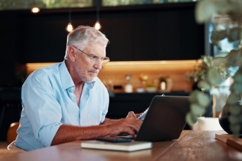 Business Owner Working at Laptop